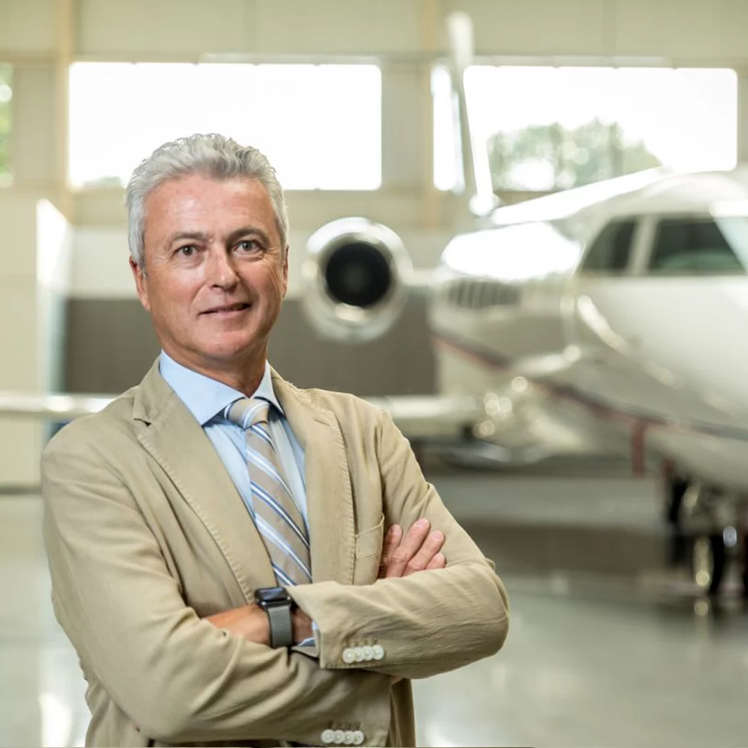Bernard Van Milders, founder of FLYINGGROUP, in front of a private jet